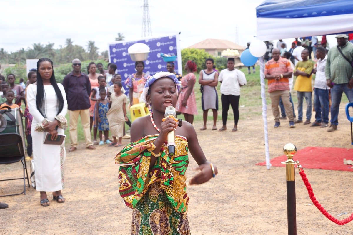 Girl speaking to the crowd at the ceremony